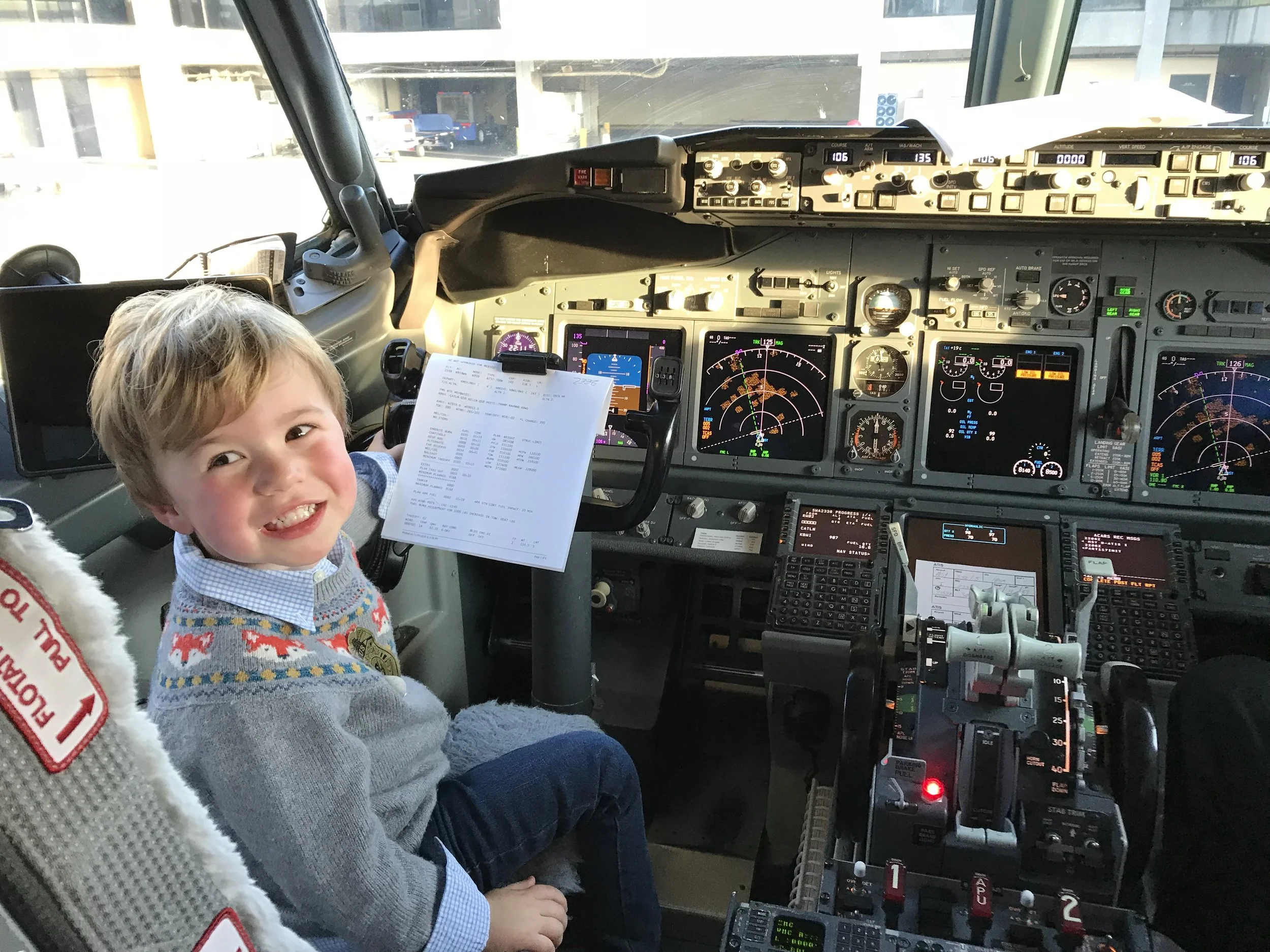 Future pilot! “ There are so many cool things about my job,” says pilot Mark Swartz, “but my favorite is when kids come up and say hi during the boarding process.”
