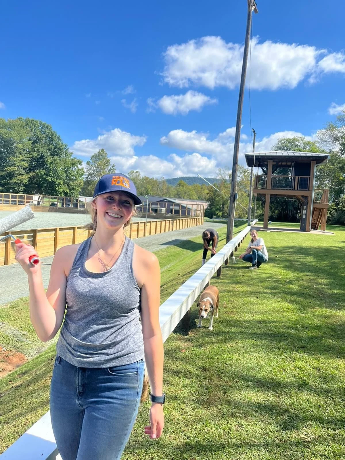 UVA polo players getting the railing shiny bright white in anticipation of hosting FIP and the upcoming fall intercollegiate season!