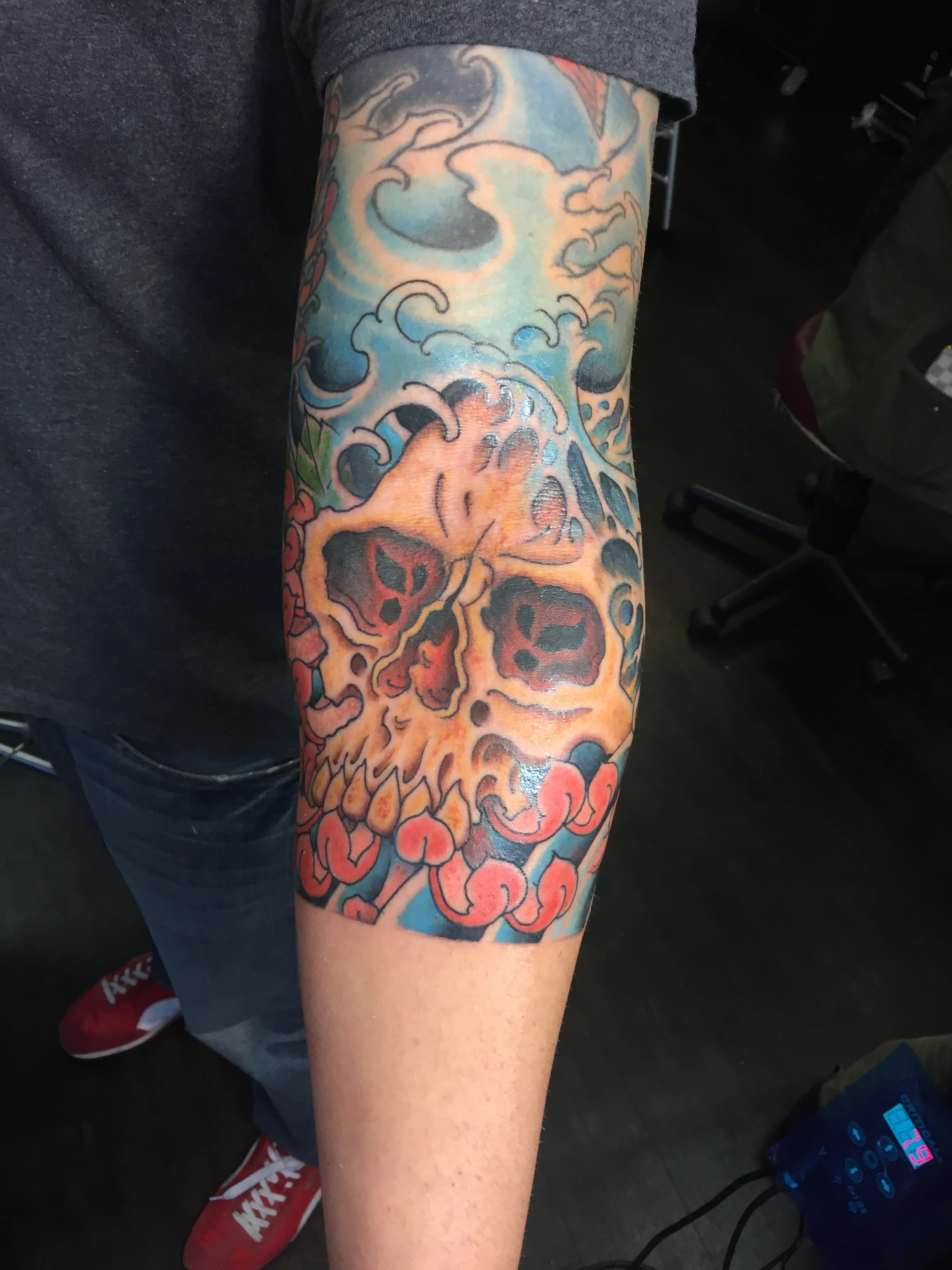 multi color full sleeve skull tattoo