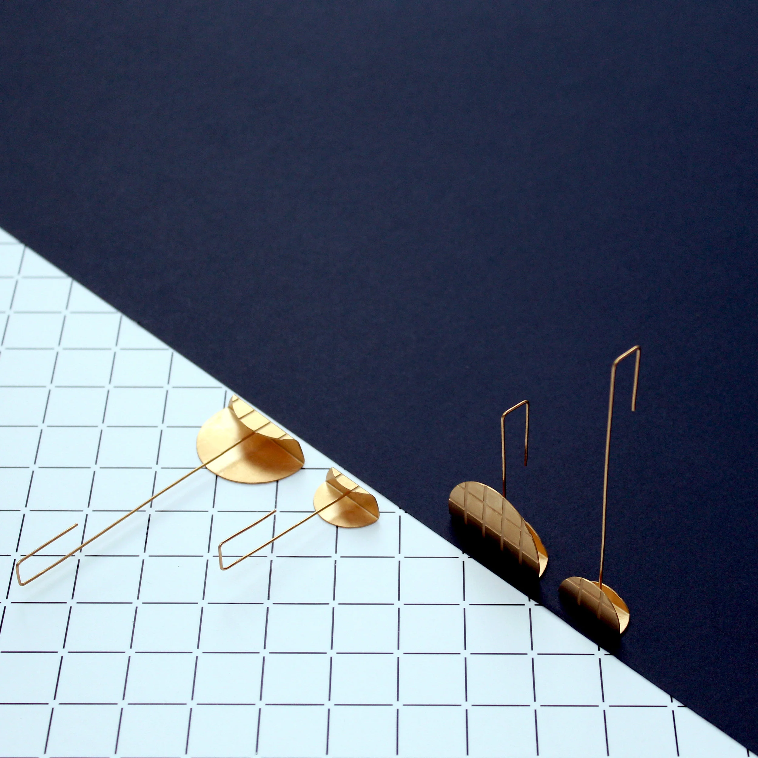 GRID EARRINGS (SOLD AS SINGLE EARRINGS SO THAT YOU CAN CREATE YOUR DESIRED PAIRING) 22 CARAT GOLD-PLATED BRASS AND STERLING SILVER SMALL LONG EARRING £90 SMALL SHORT EARRING £90 LARGE LONG EARRING £140 LARGE SHORT EARRING £140