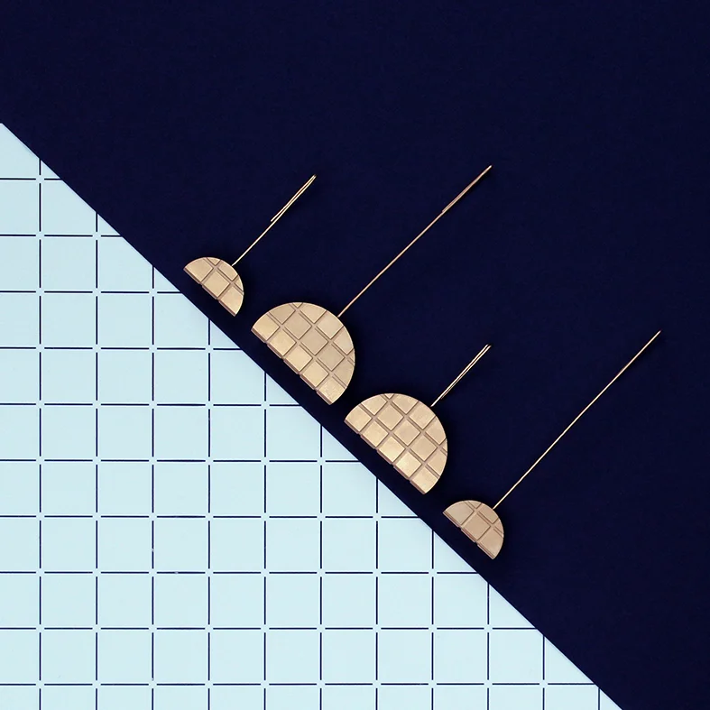 GRID EARRINGS (SOLD AS SINGLE EARRINGS SO THAT YOU CAN CREATE YOUR DESIRED PAIRING) 22 CARAT GOLD-PLATED BRASS AND STERLING SILVER SMALL LONG EARRING £90 SMALL SHORT EARRING £90 LARGE LONG EARRING £140 LARGE SHORT EARRING £140