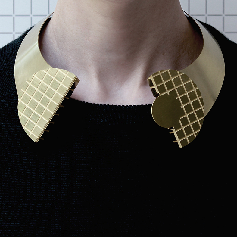 one+piece+winged+collar+in+brass+(front+view+on+model).jpg