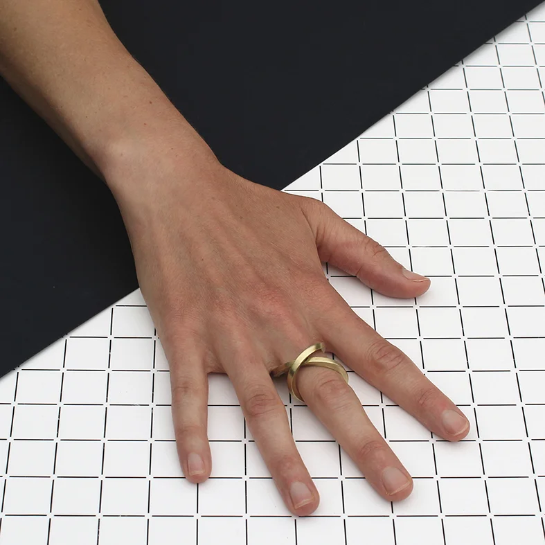 www.poppynorton.com - infinity ring (model wearing it as a crossover ring).jpg