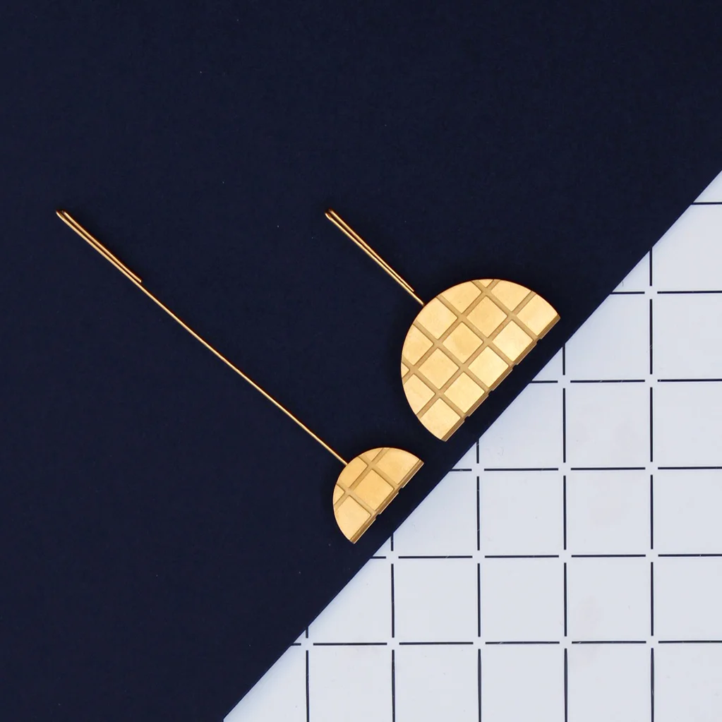 www.poppynorton.com - pair of grid earrings (overhead).jpg