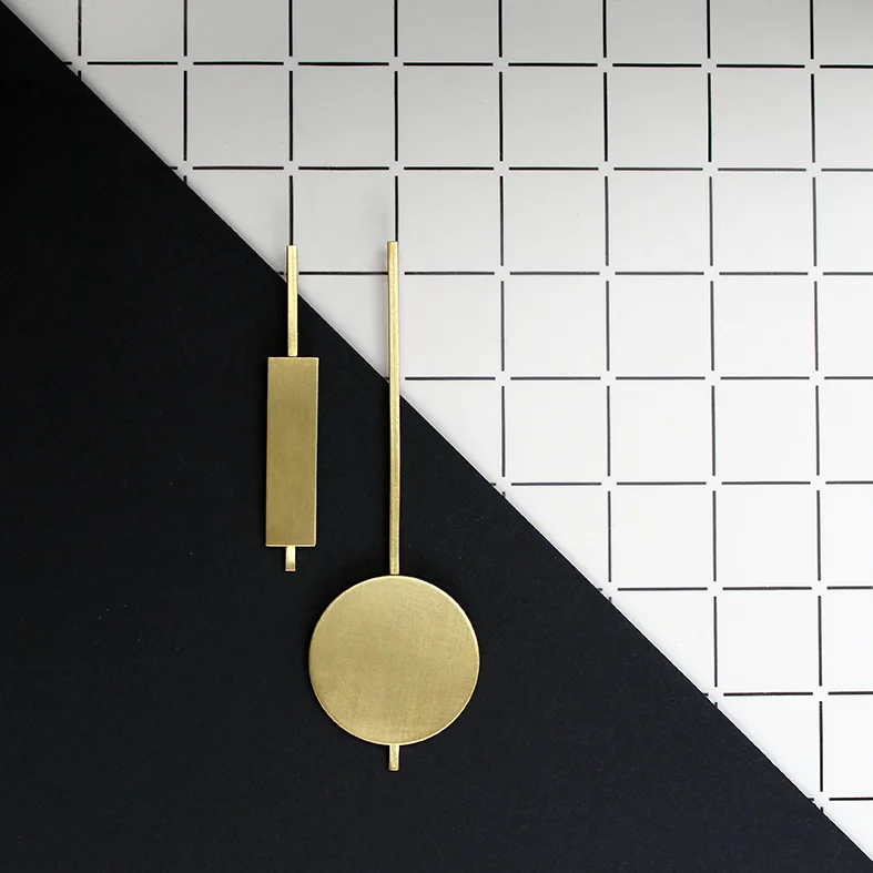 www.poppynorton.com - pendulum earrings overhead.jpg
