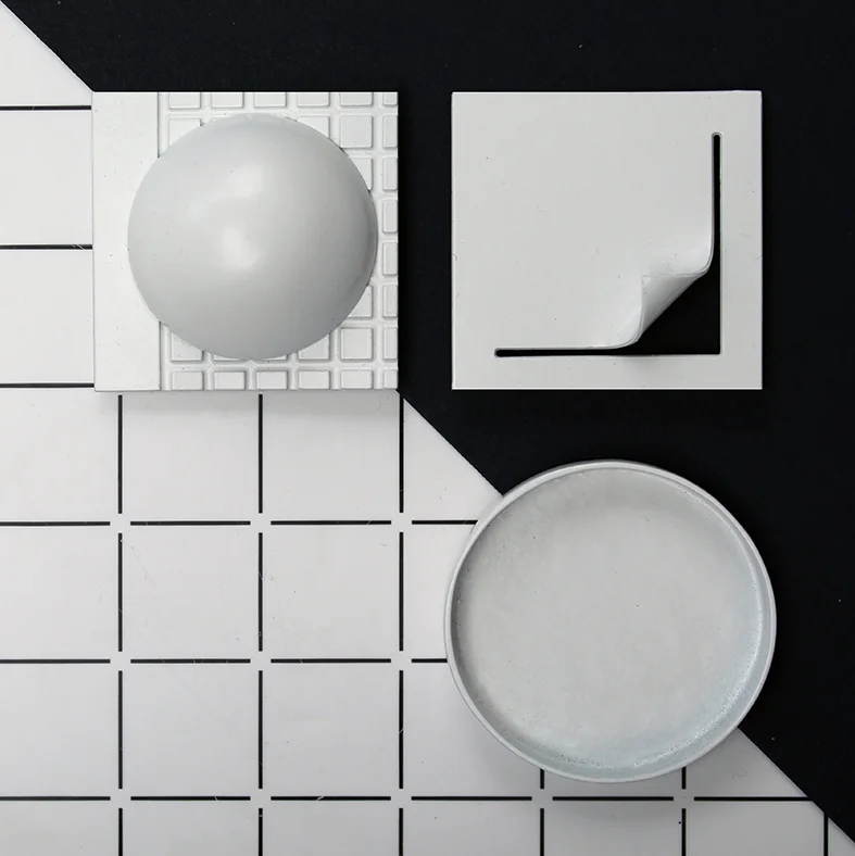 www.poppynorton.com - shapes brooches in white overhead.jpg