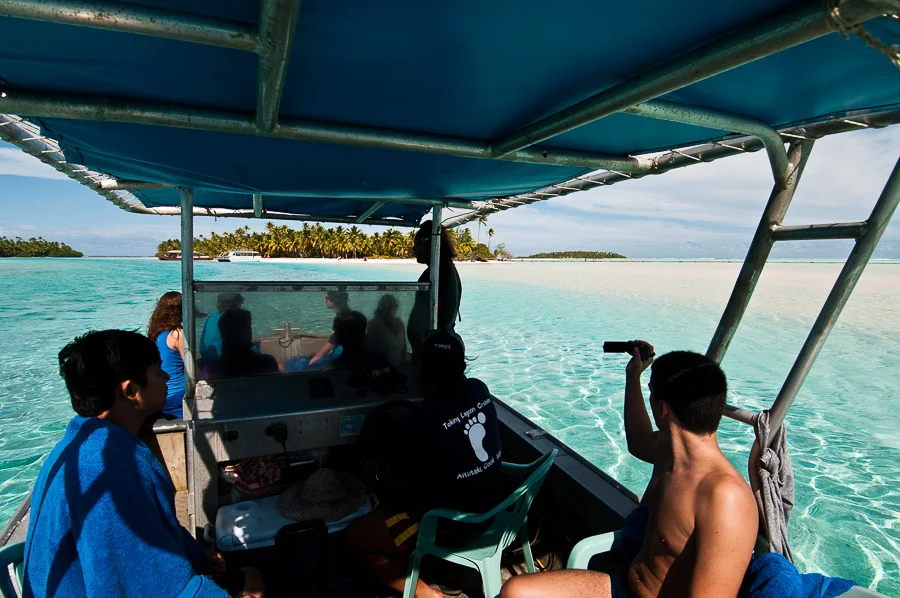 Approaching One Foot Island during a day trip island hopping and snorkelling, Aitutaki Island, Cook Islands.