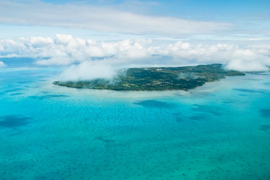 Aerial view of lagoon and Aitutaki Island, Cook Islands.