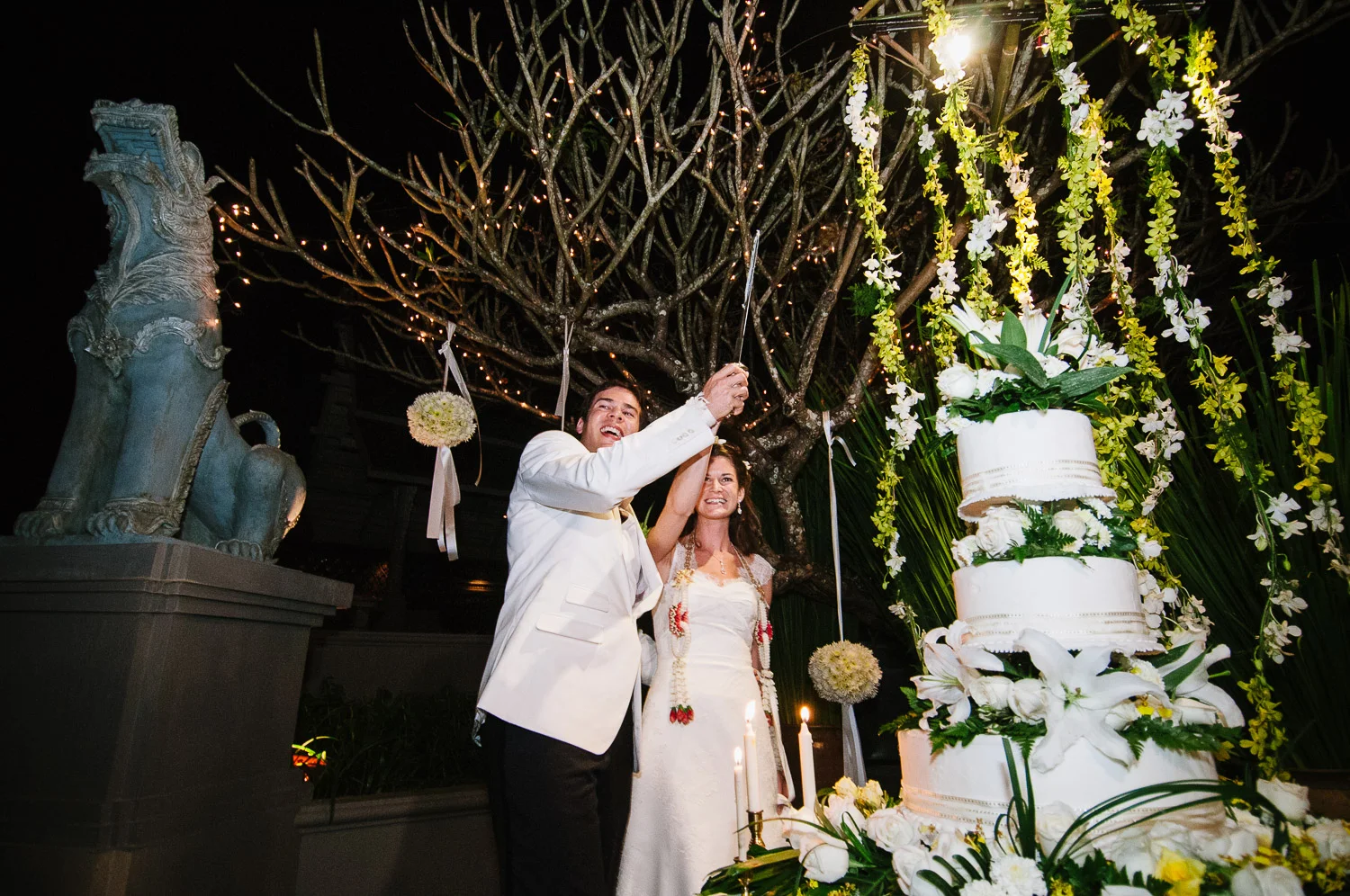 Four Seasons Resort Chiang Mai Wedding, Katie & Tim cutting the cake.