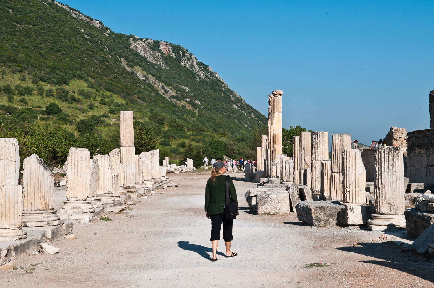 Woman walking amongst ruins, Ephesus, Turkey.