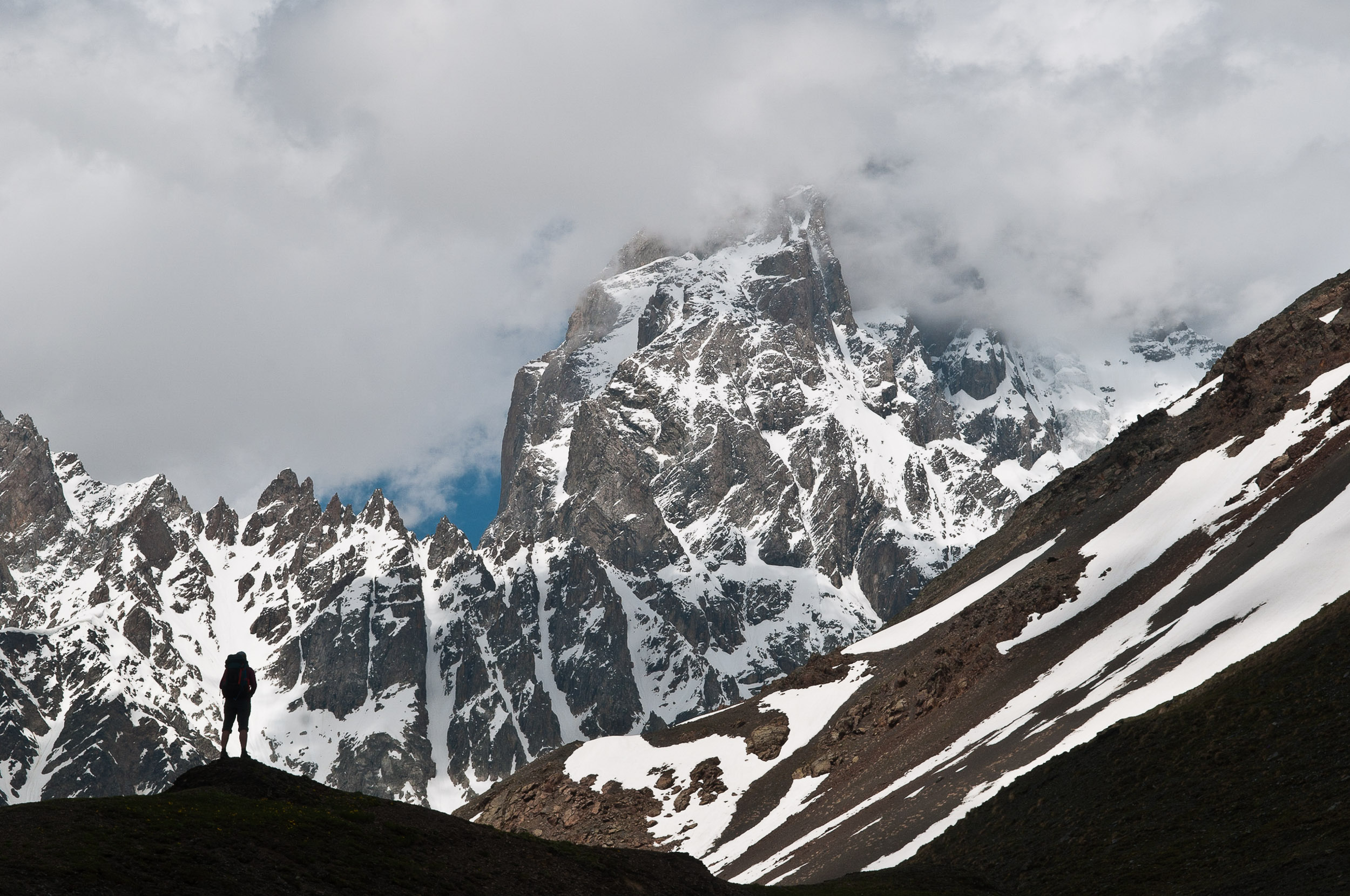 Woman and Kazbegi Mountain, near Mestia, Georgia.