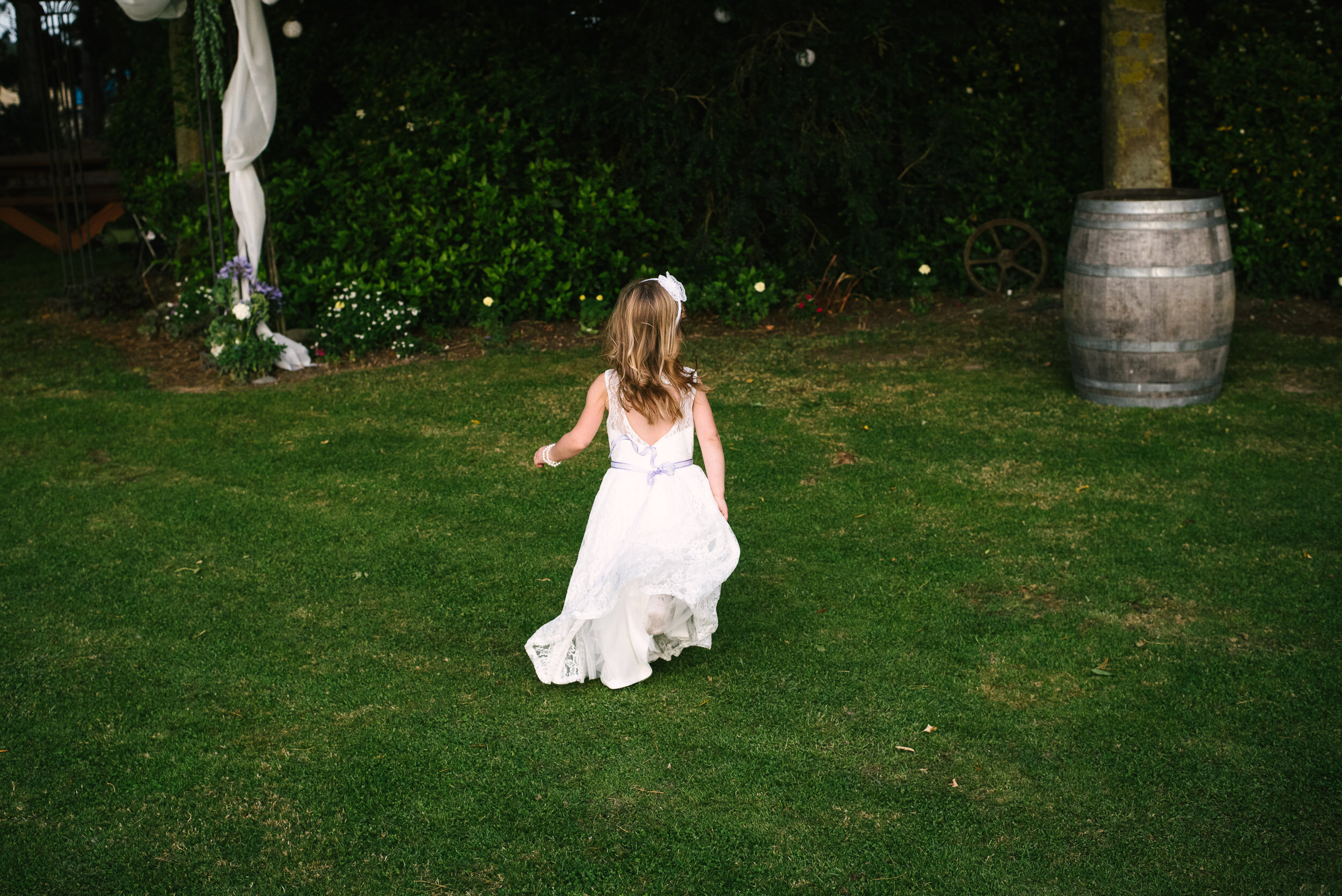 Young girl playing at a wedding at    Darjon Vineyard.    © Thomas Pickard | www.myweddingphotographer.co.nz