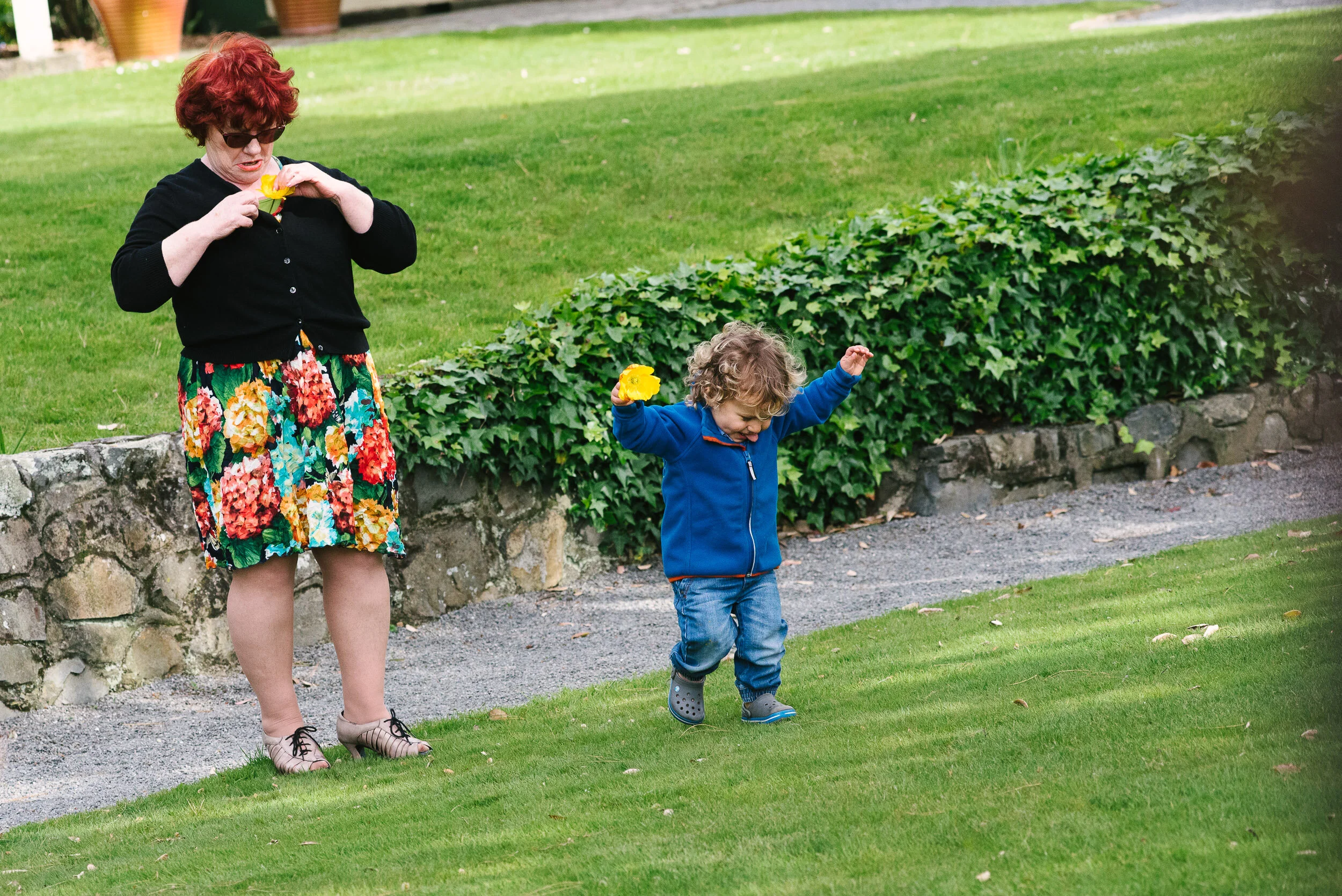Young boy and flower, Gear Homestead wedding.