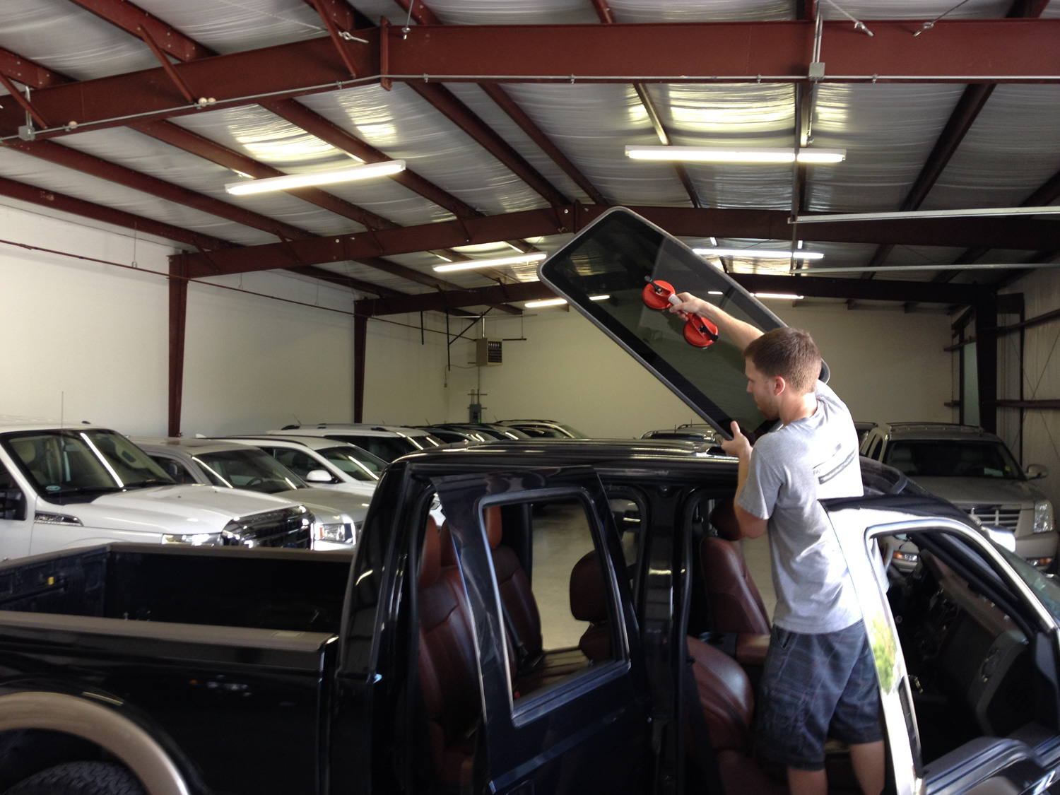 Sunroof glass installation on Ford F-150 truck