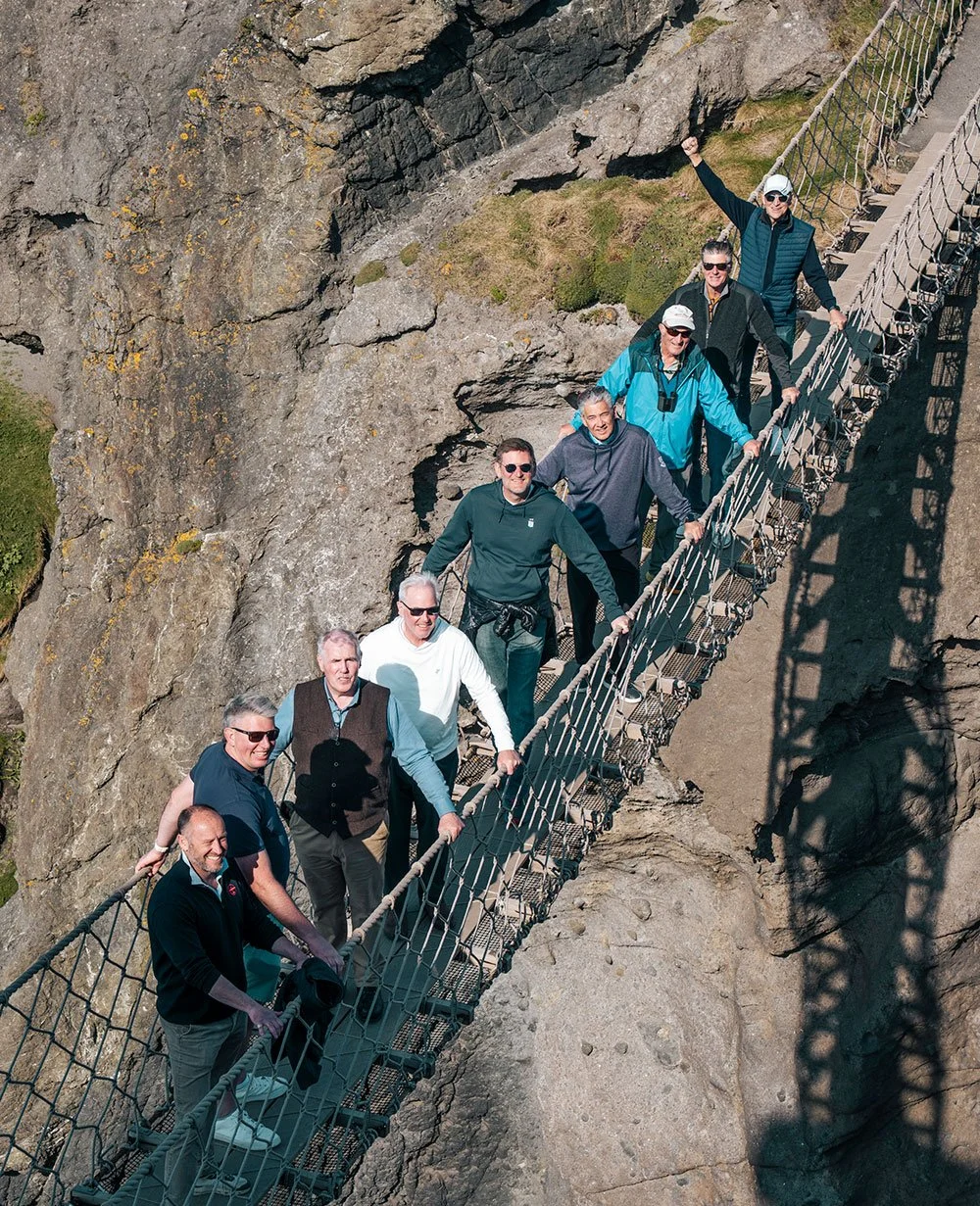 9 group members on Carrick-A-Rede Rope Bridge