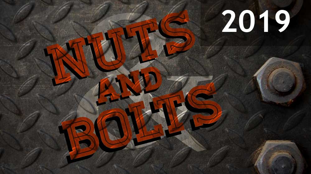 Gray sheet metal with nuts screwed in on the right side. 'Nuts and Bolts 2019' is superimposed on top