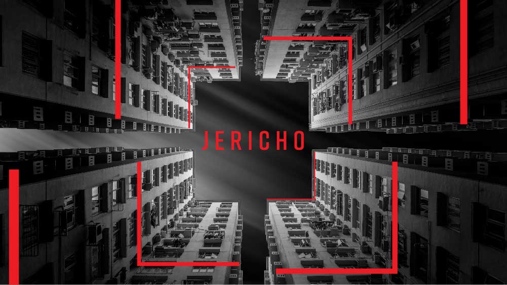 A view straight-up from the base of several skyscrapers. 'Jericho' is written across the sky in red.