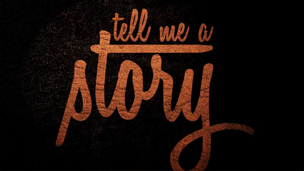'Tell me a story' is written across a dark background