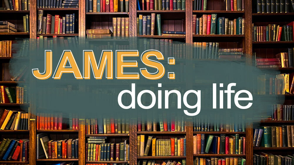 Books sit on shelves in a library. 'James: doing life' is superimposed