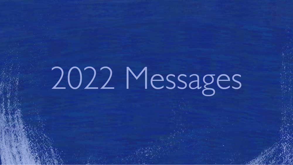 Blue paint streaks across the background. '2022 Messages' is written on top.