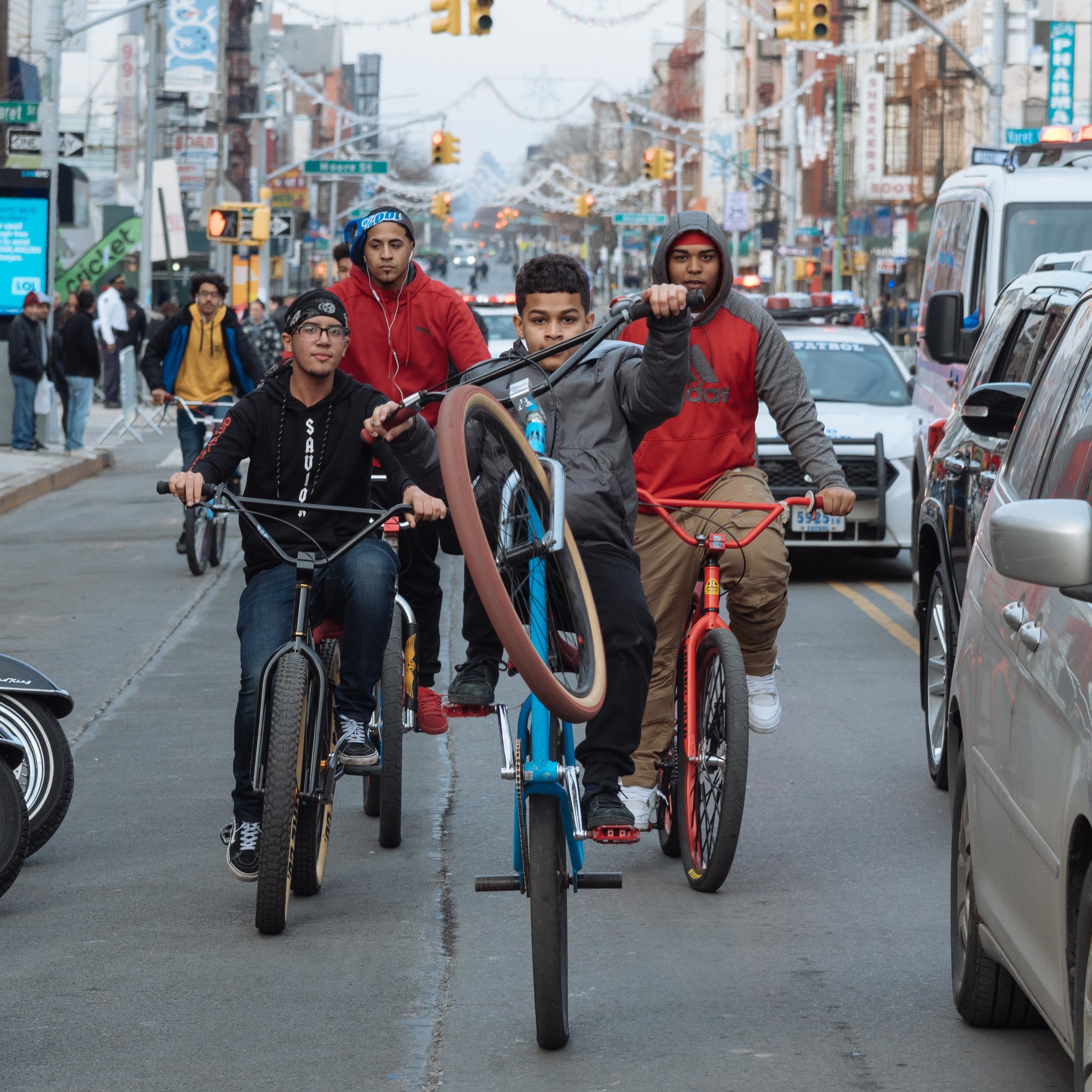  Young cyclists on Graham Avenue during the Three Kings Parade in Williamsburg 