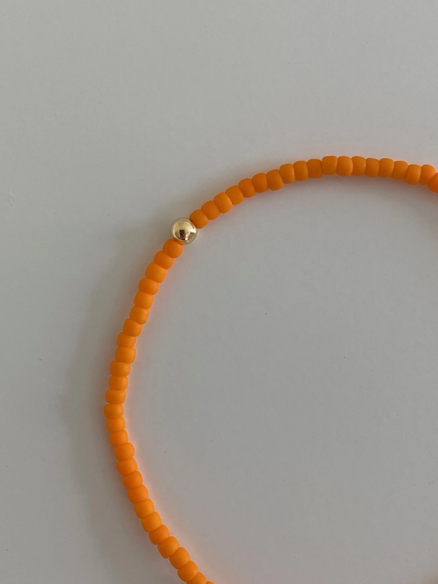 JOYEM Orange Bracelet Close-Up.jpg