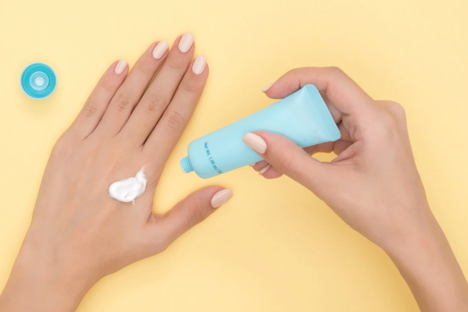 Canva+-+Person+Pouring+Plastic+Tube+Bottle.jpg