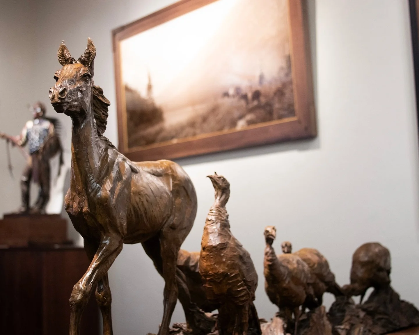 Richard Loffler strives to capture the spirit and character of his subjects, astutely on display in the promenade of “Barnyard Politics.”
“Barnyard Politics”
Richard Loffler
21.75×63.5×15″ | Bronze
$18,000