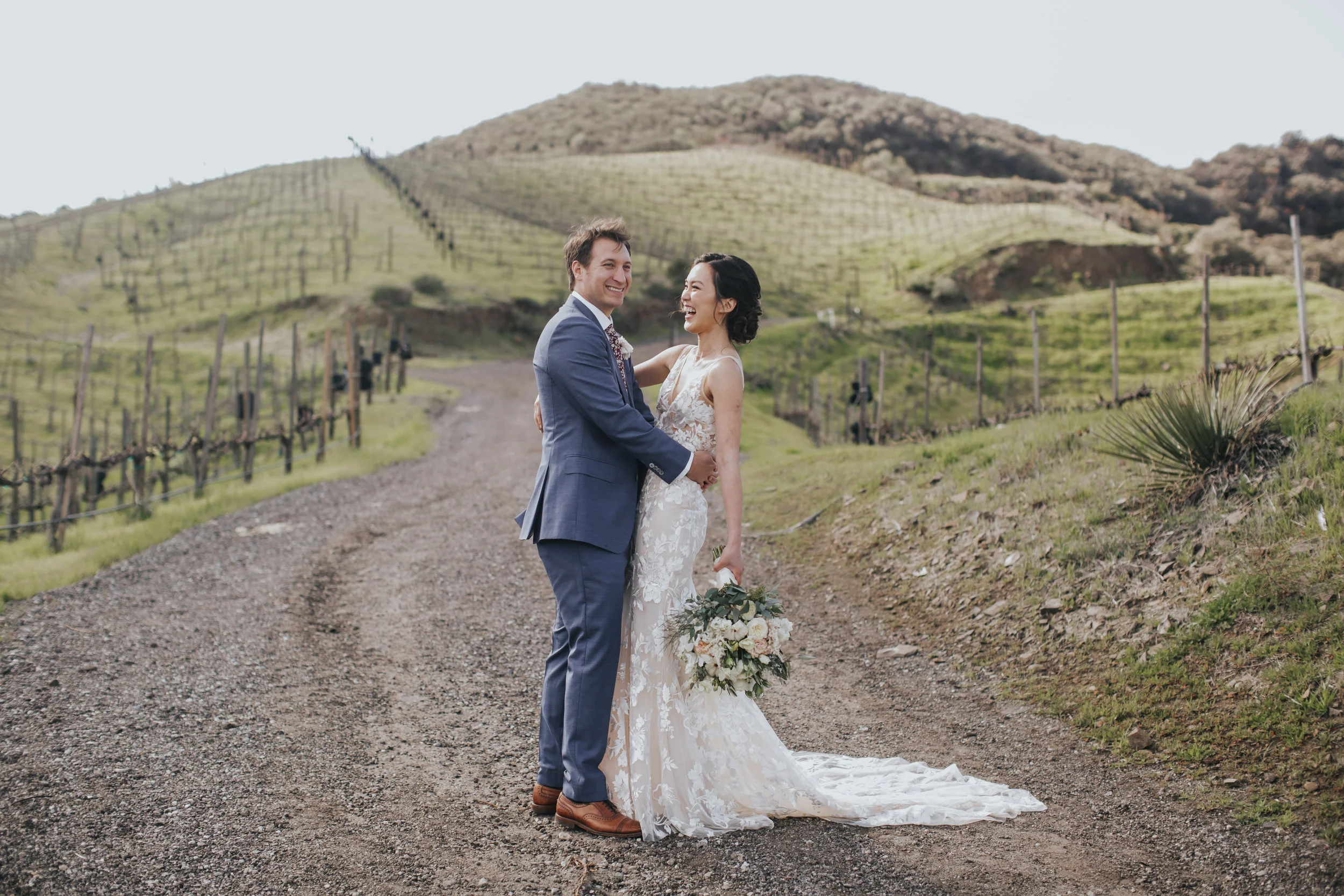 lace wedding dress, bridal up-do, bride and groom first walk, long wedding dress train, Malibu wedding || Orange Blossom Special Events