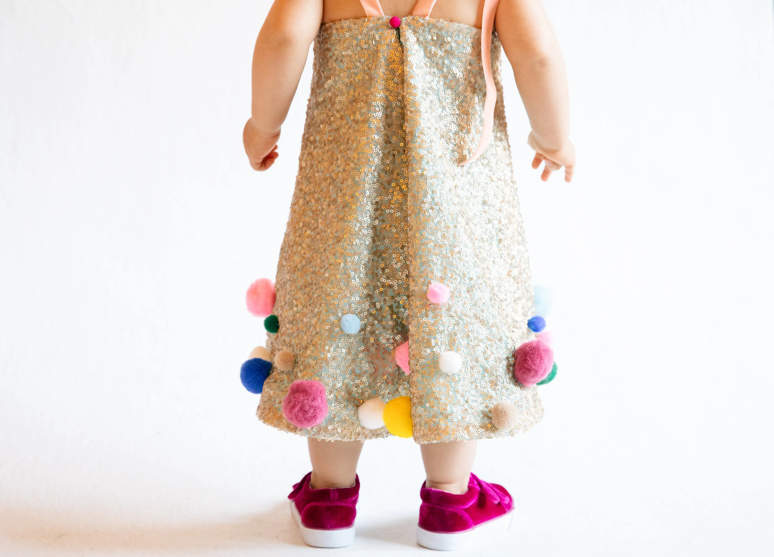 Girl's wedding dress colorful pom poms by Miss Tashina || Orange Blossom Special Events