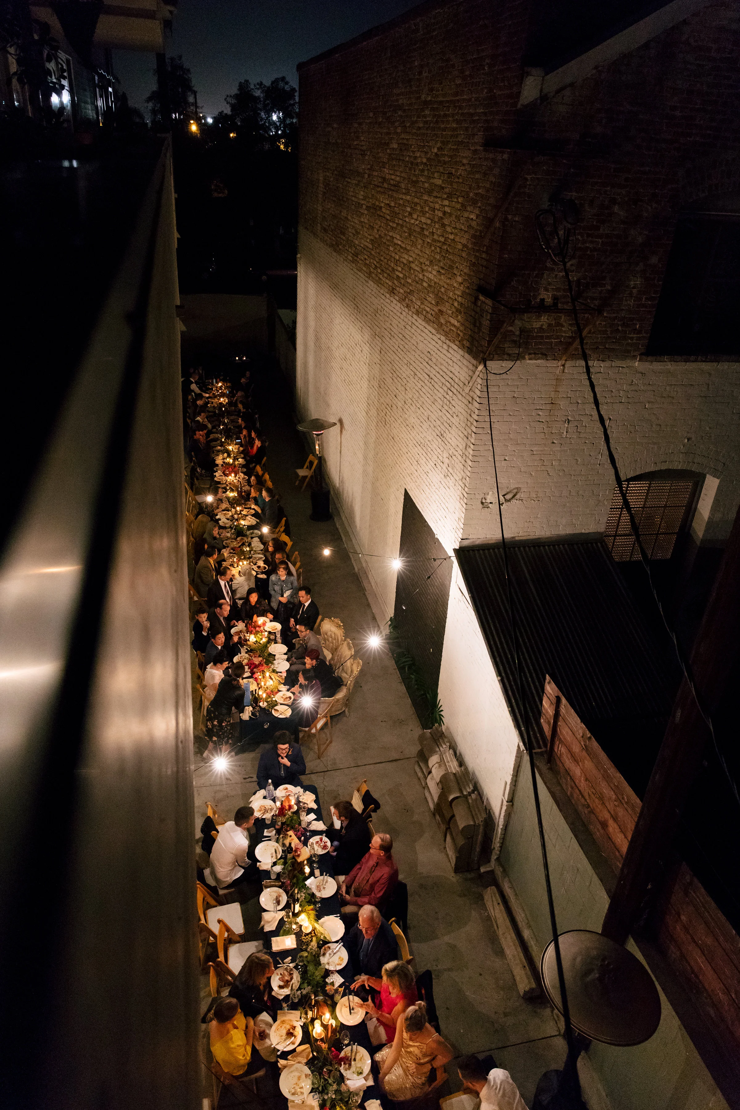 Seated outdoor urban wedding dinner || Orange Blossom Special Events