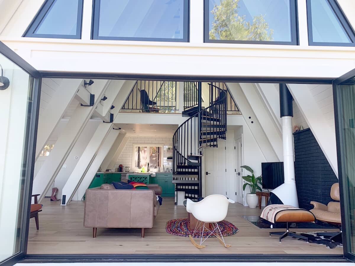 one of the A-Frame Cabins in airbnb with glass windows 