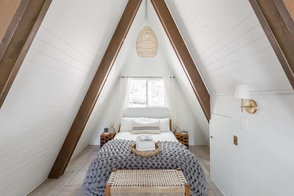 bedroom in a Modern A-Frame with Vintage Charm