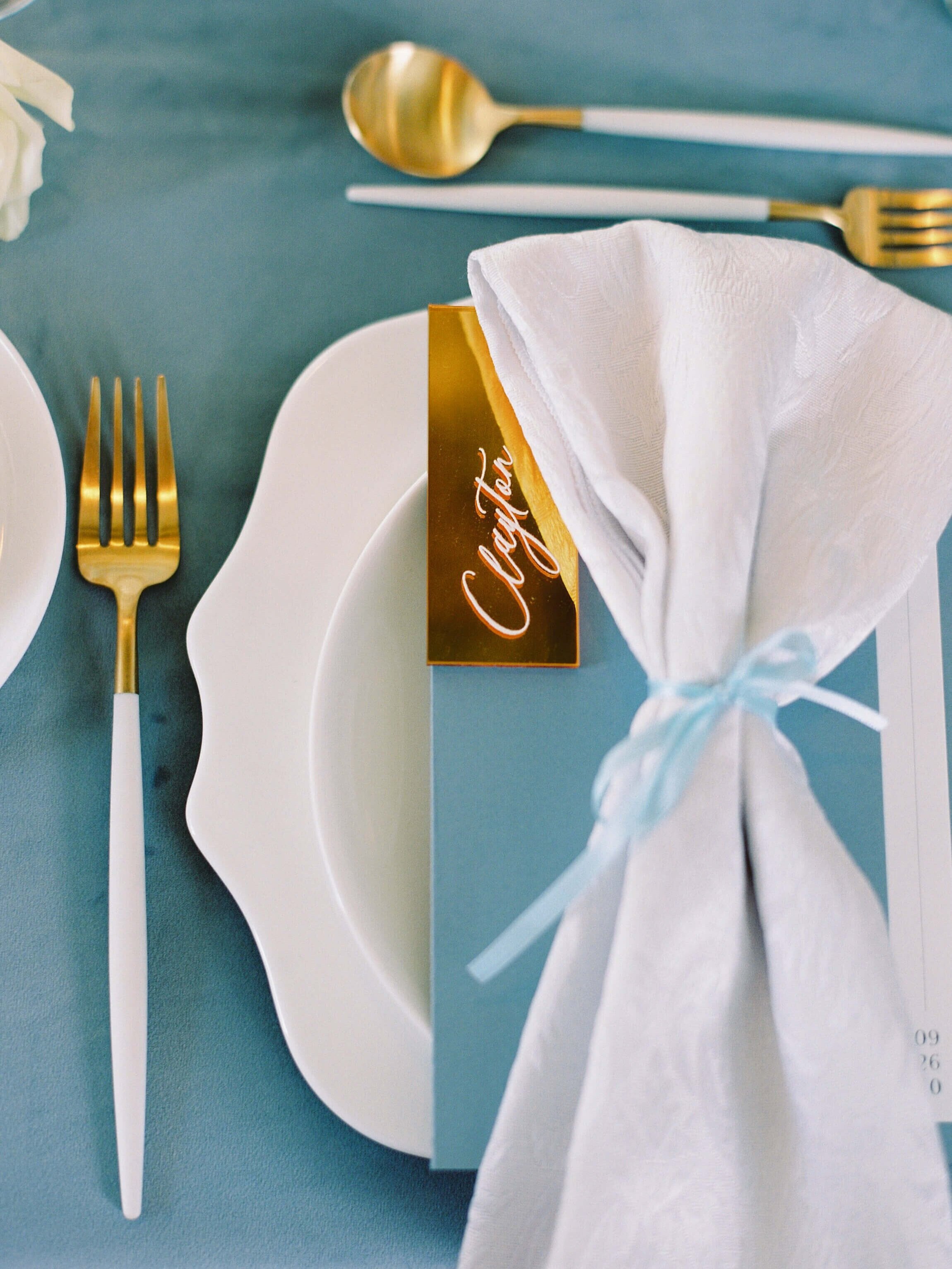 Blue wedding menu with gold place setting