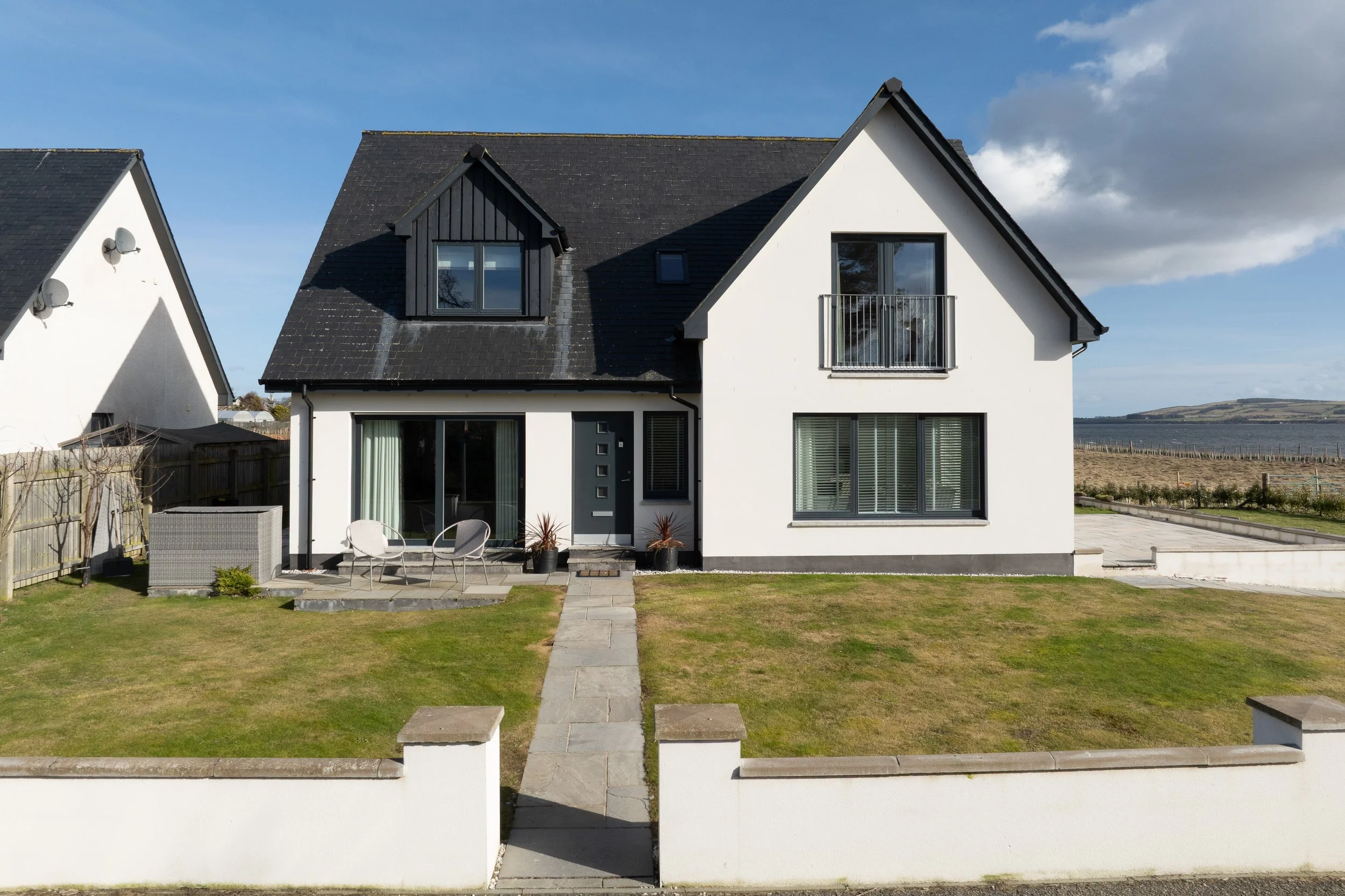 Exterior photograph of a modern architect designed coastal home in Easter Ross, Highland
