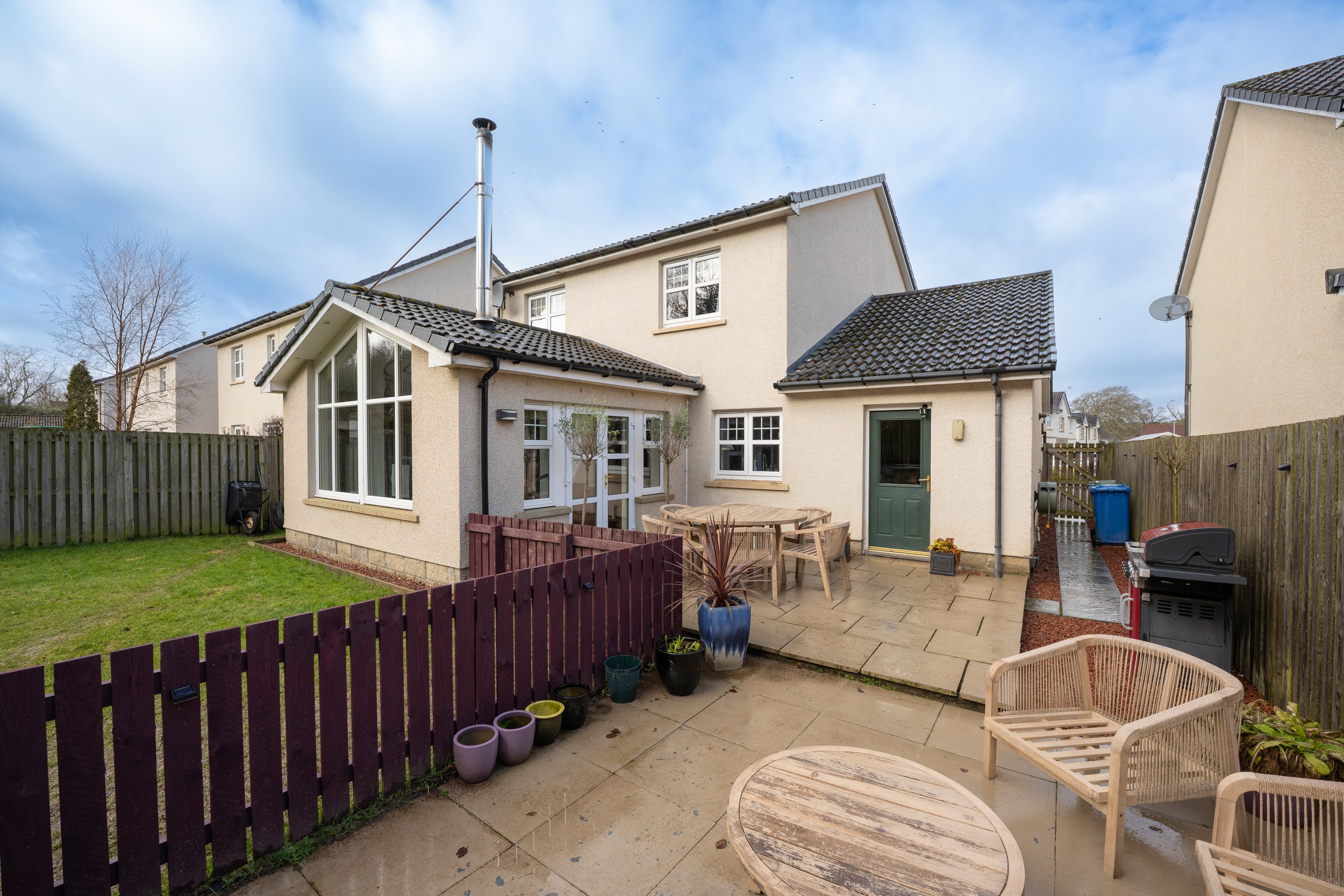Rear of house photograph of a modern estate build in Inverness