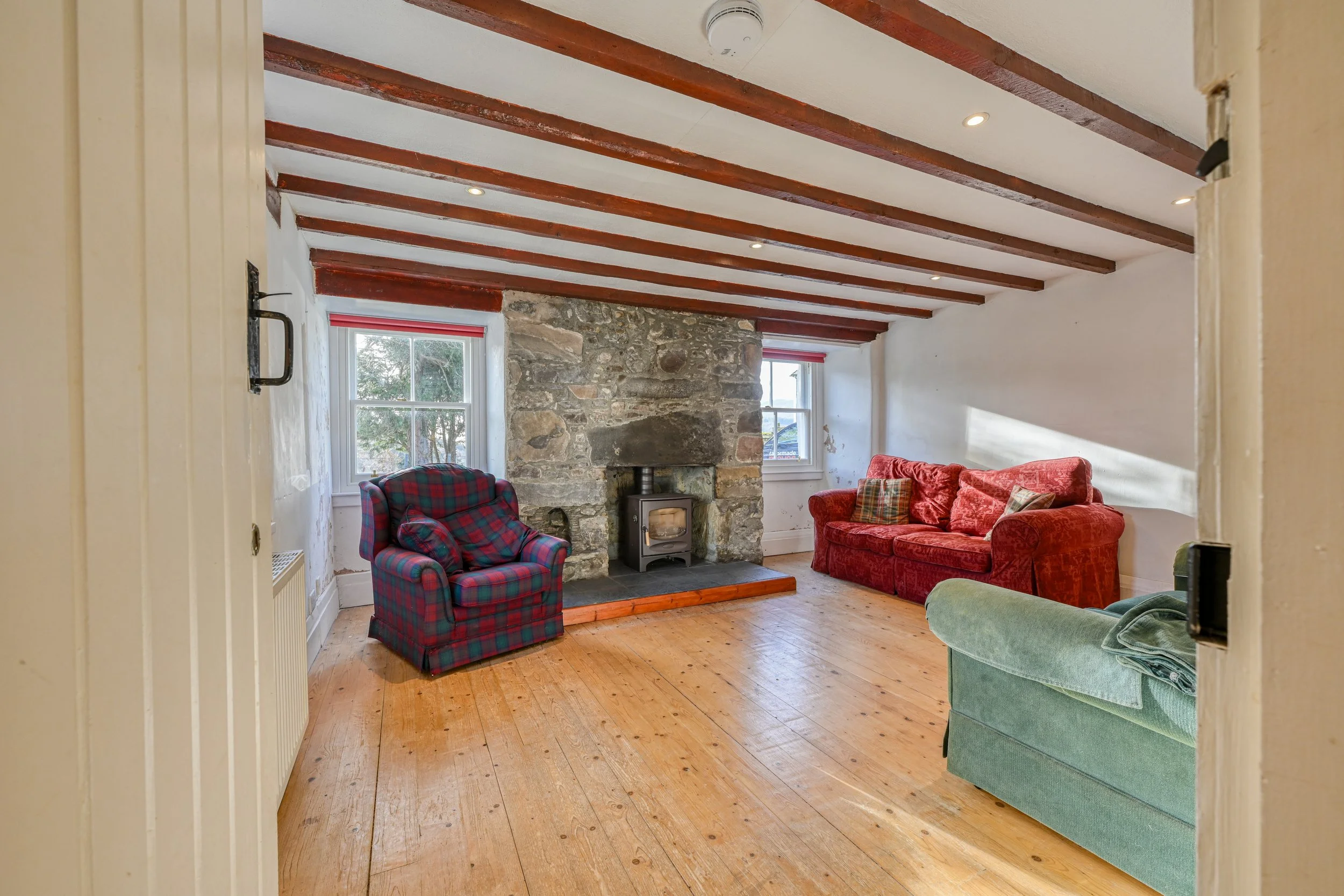 Photograph of a cosy Highland living room in an old croft house on Loch Ness