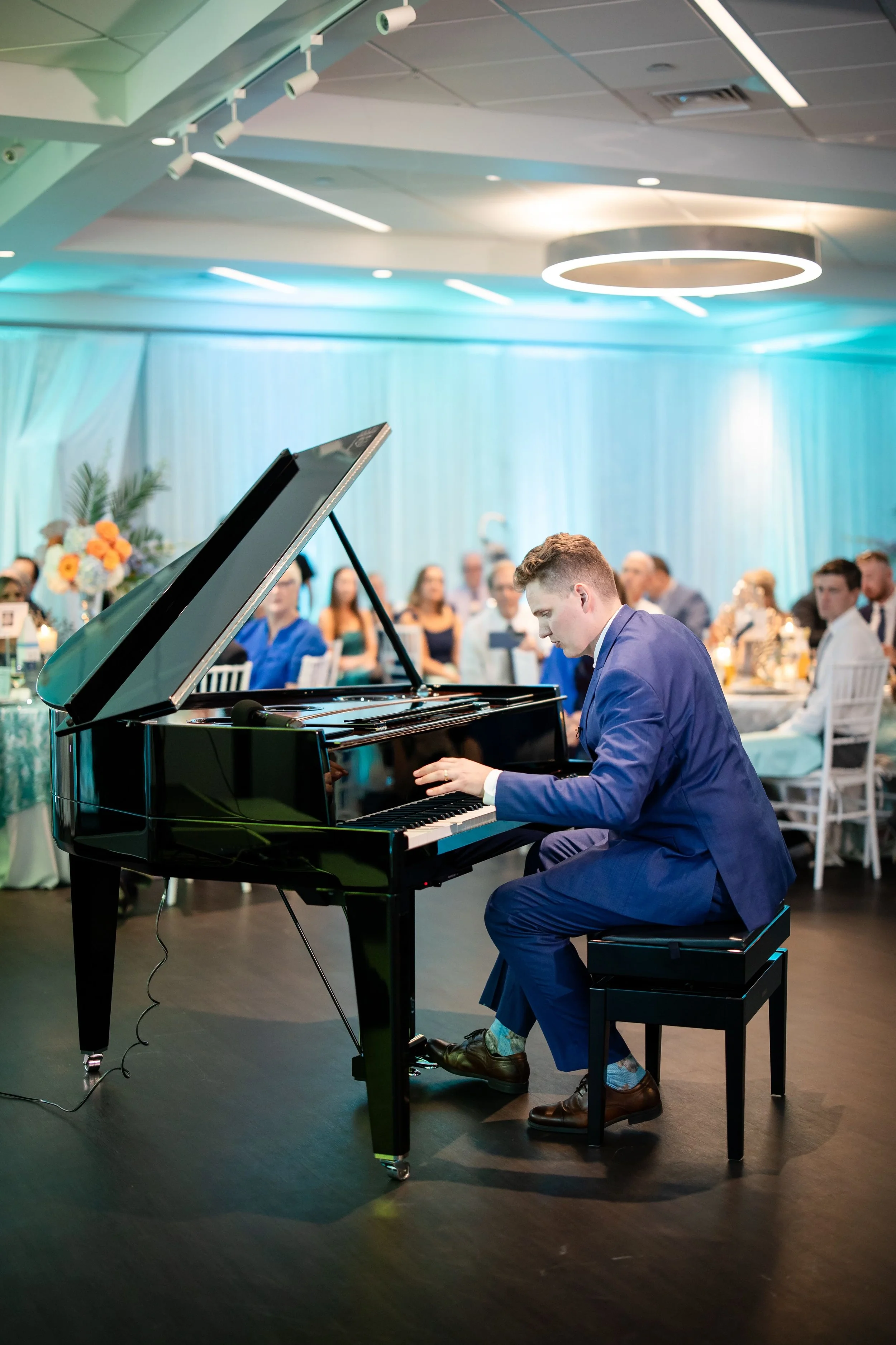 Carter playing piano with one hand.jpg