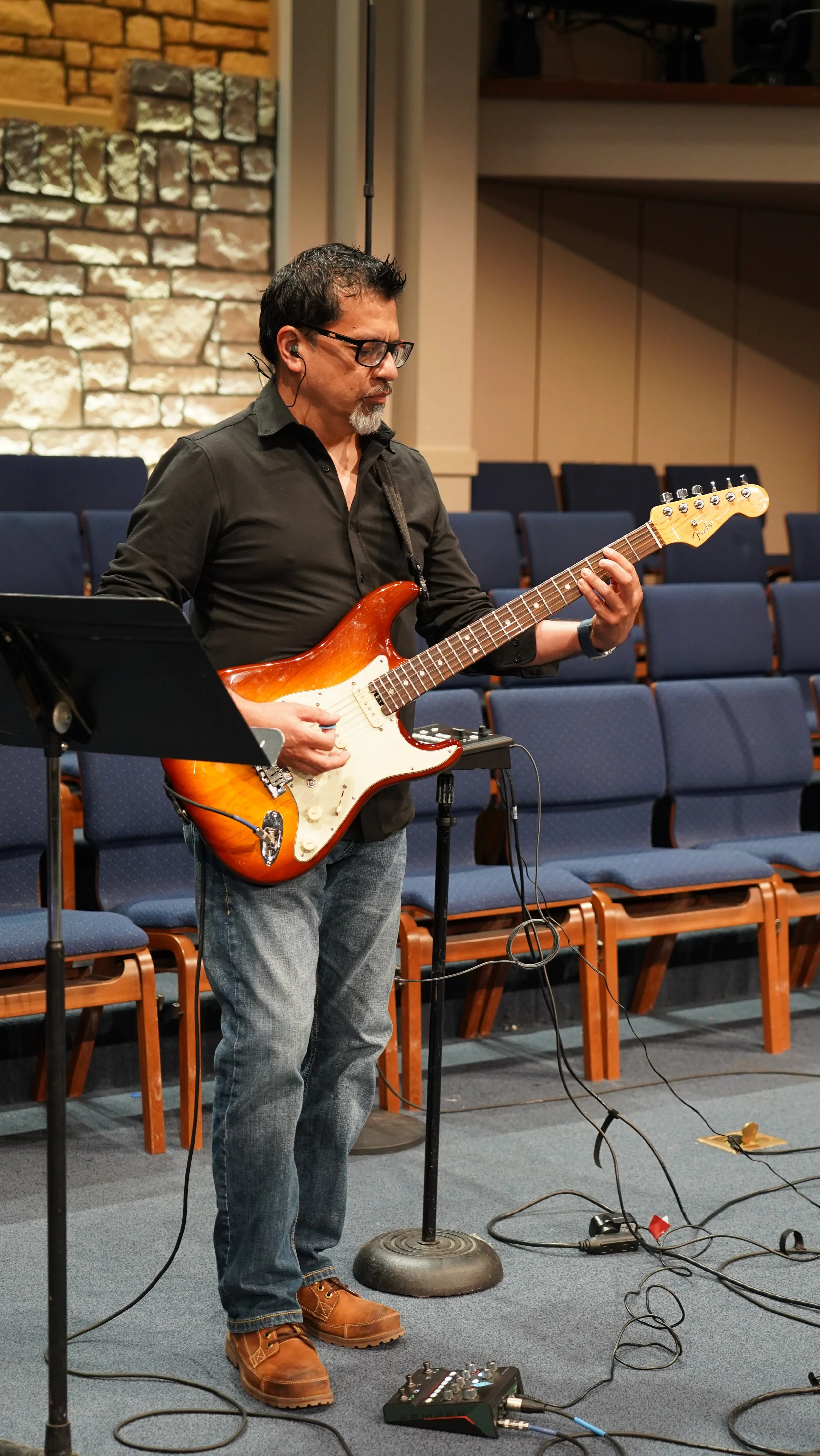 Electric guitar player for our live band performance.