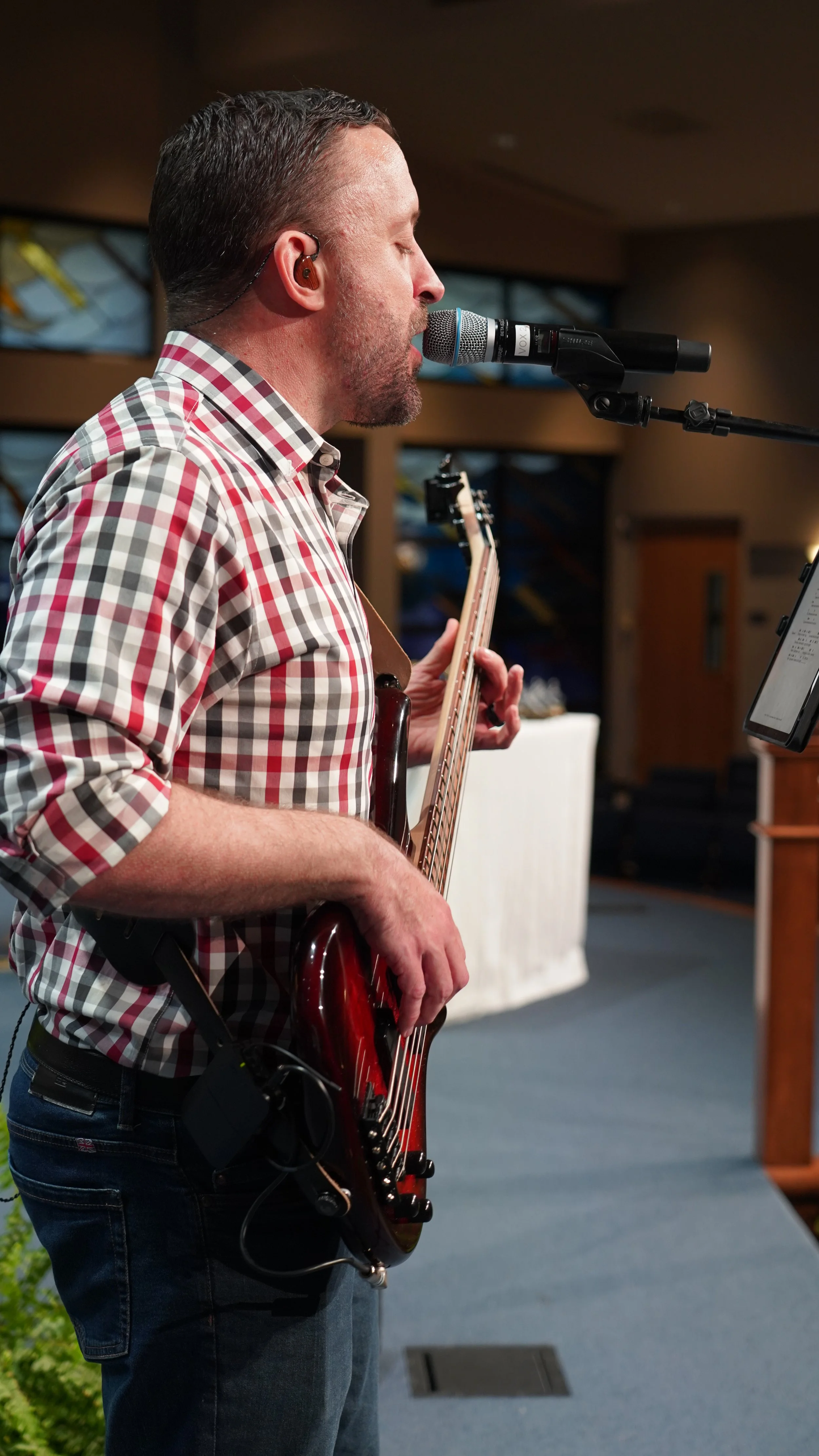 Rehearsing with the lead vocalist.