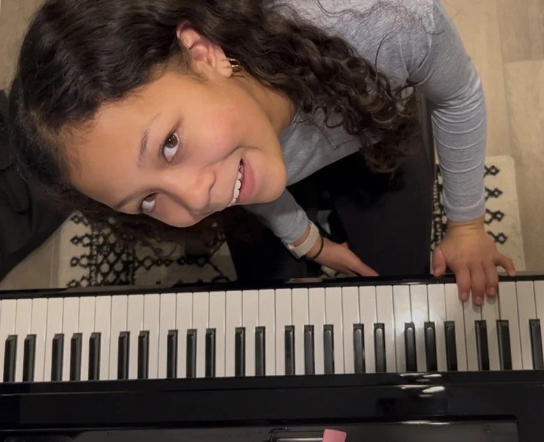 Young piano student taking creative piano lessons in Centennial, Colorado