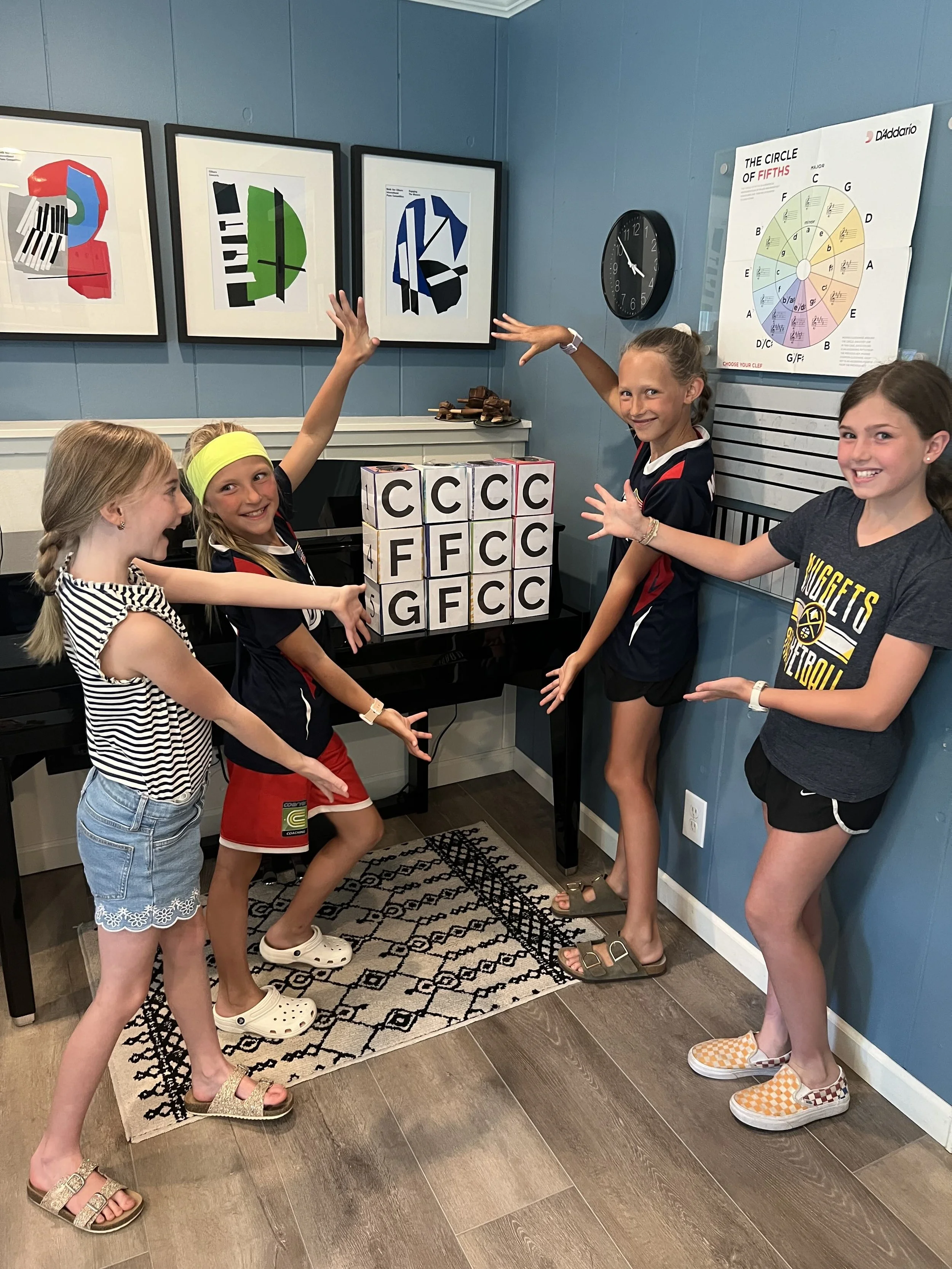Students participating in creative piano activities at piano studio in Centennial, Colorado