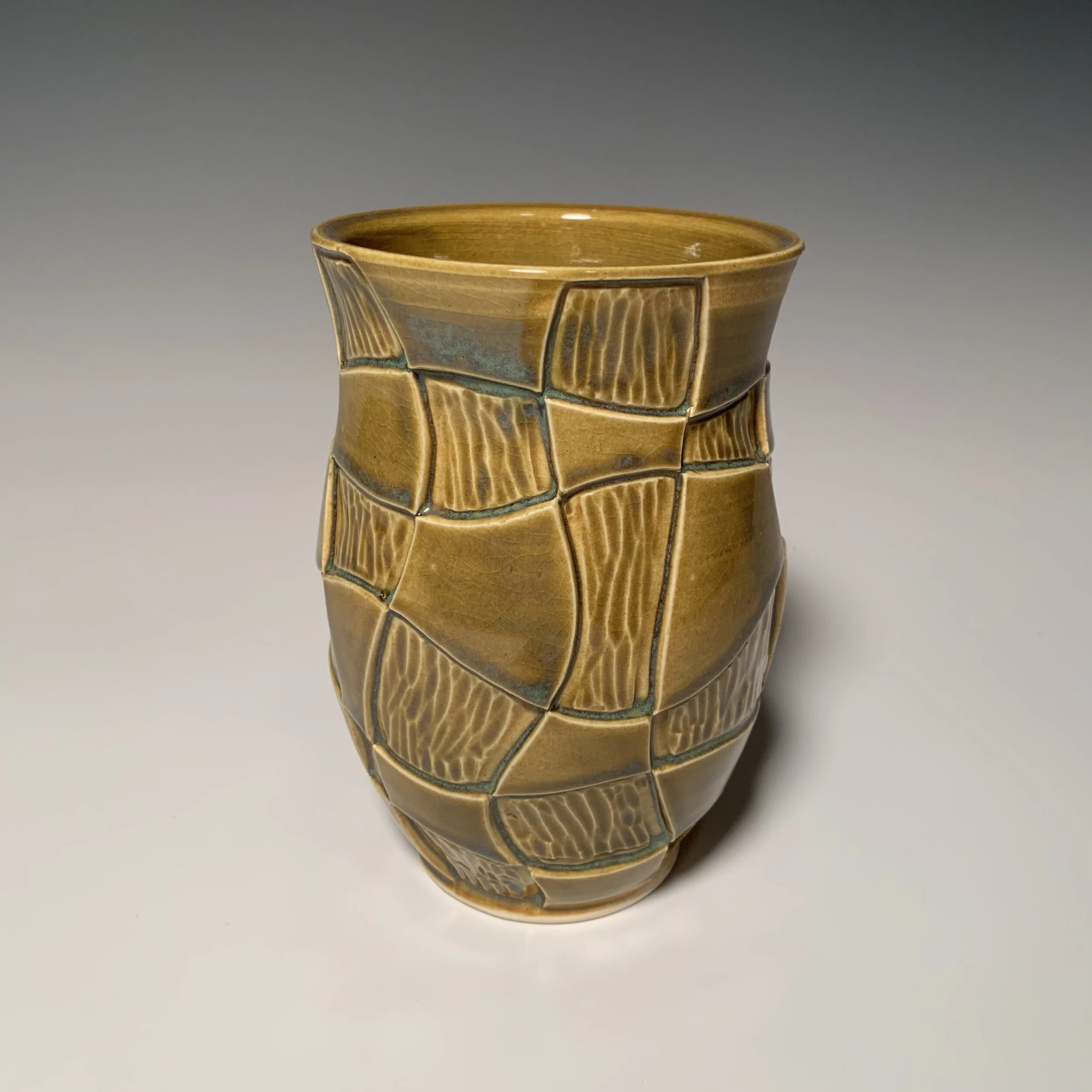 Golden carved vase alternate view