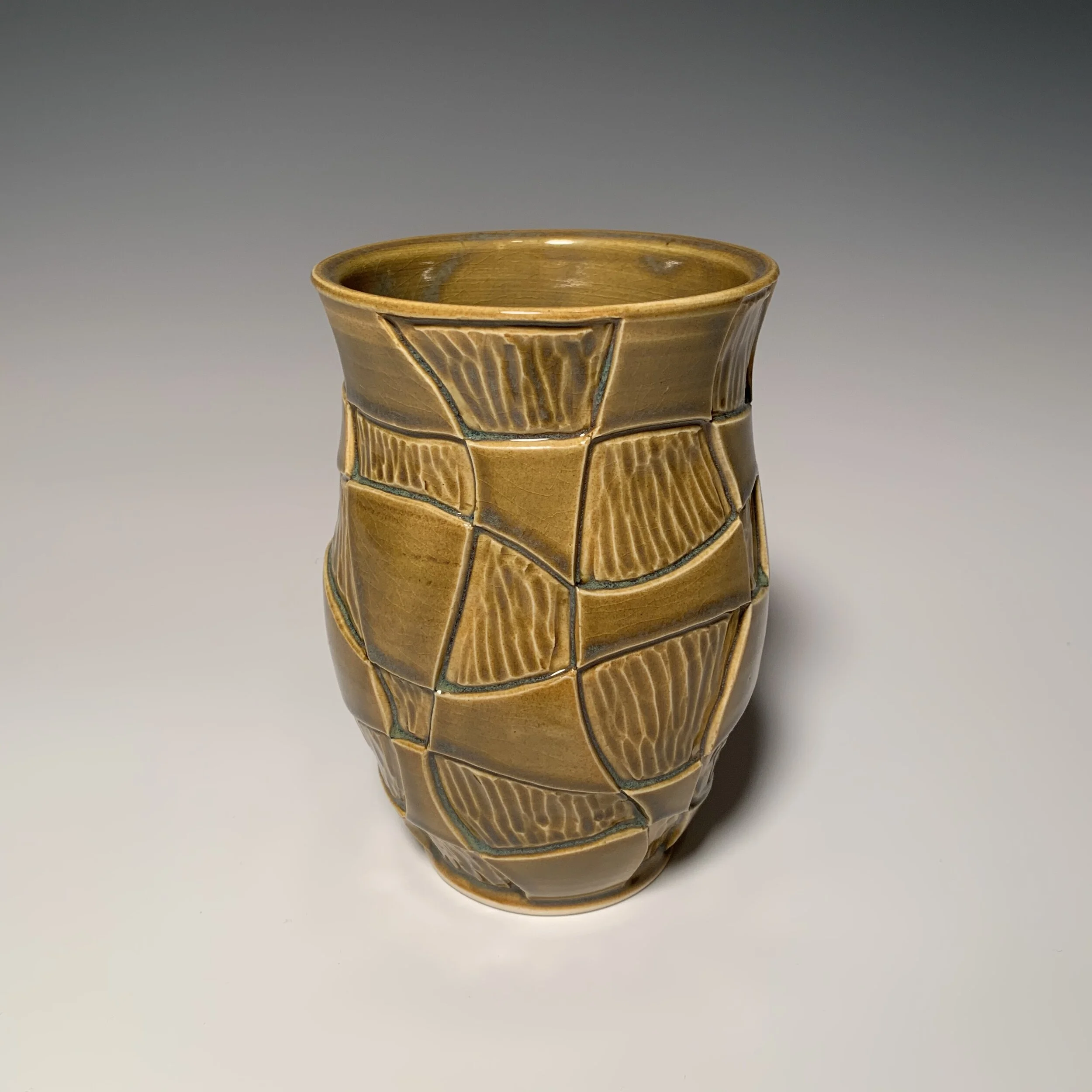 Golden carved vase