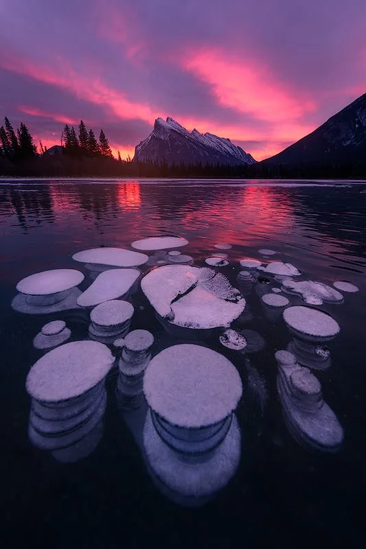 Methane bubbles trapped in ice on the newly frozen Vermillion Lake in Banff National Park in Canada. Nikon Z7 | Nikon 14-24mm