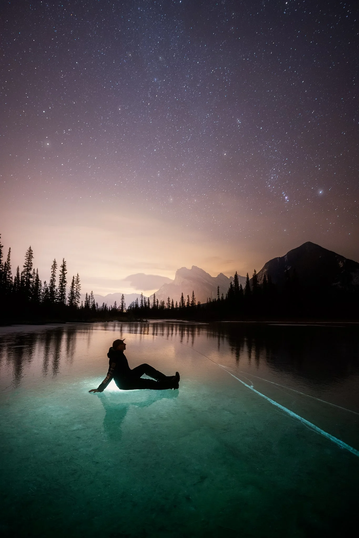 A self portrait on a frozen lake while taking in the night sky. Nikon D850 | Nikon 14-24mm