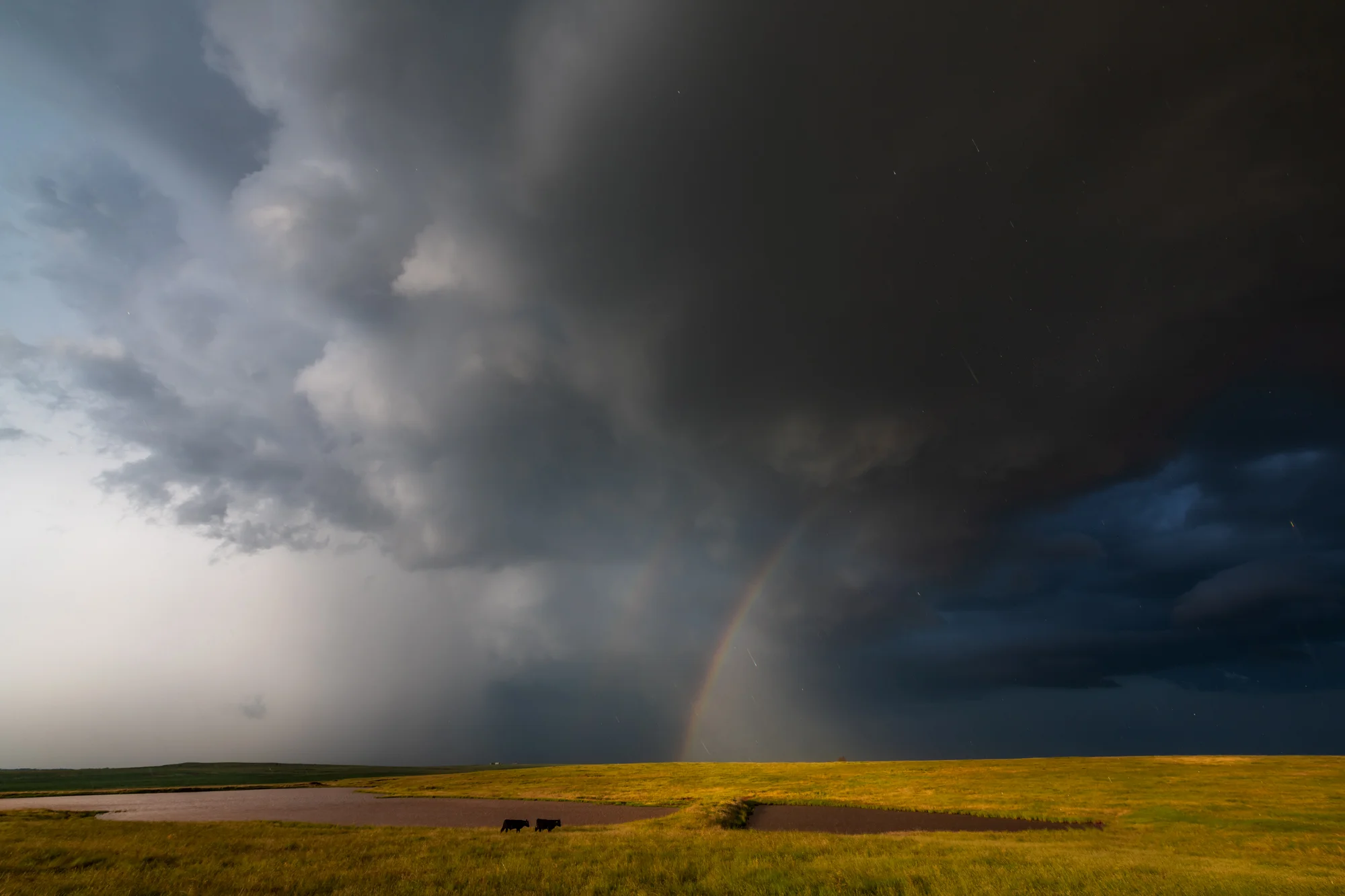 A circular polarizer was used here to help with contrast in the clouds but more importantly to help bring out saturation in the colors of the rainbow. - Wichita Falls, Texas