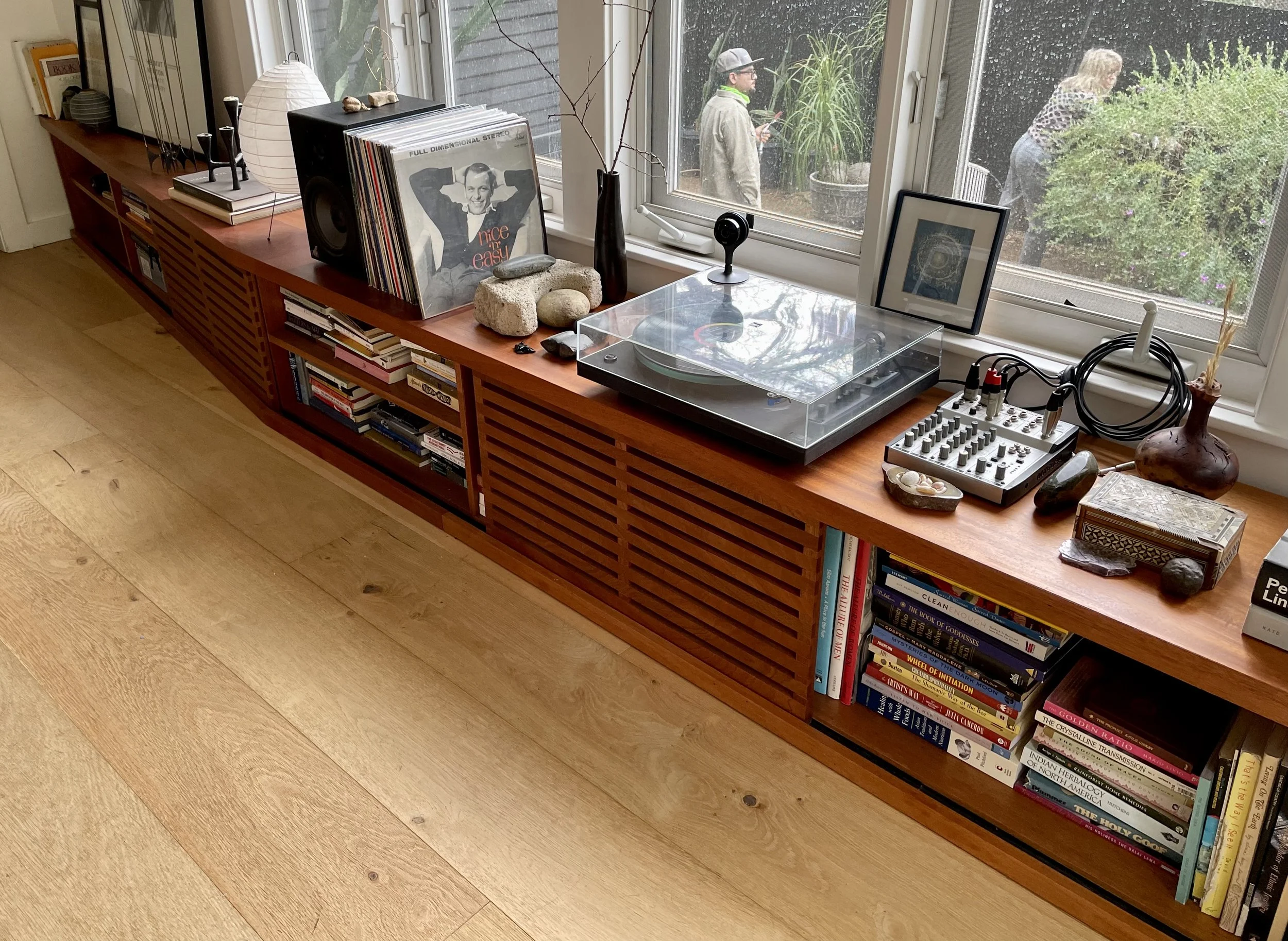 Custom mahogany bench/ storage unit with sliding doors. 18 foot long 