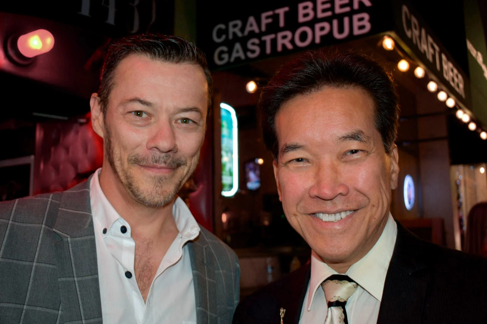 Actors Massi Furlan and Peter Kwong enjoy a night of talent in support of the Bring Hollywood Home Benefit.