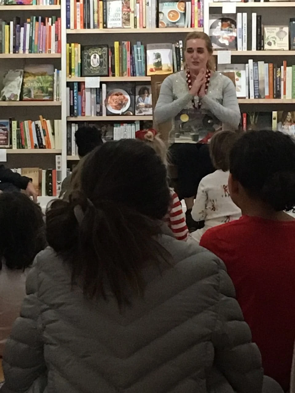 Becky reading (rather blurrily) the Polar Express to a roomful of kids in pajamas on Saturday night.